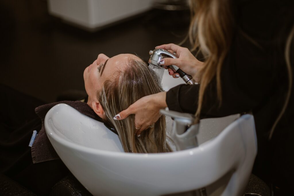 A stylist trimming hair for a fresh look