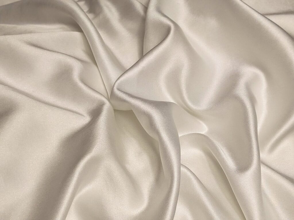 Silk pillowcase on a luxurious bed setting